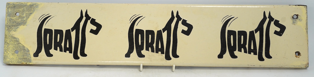 A vintage Spratt’s 'Three Terrier' enamel advertising sign, 51cm wide, 11cm high. Condition - poor to fair